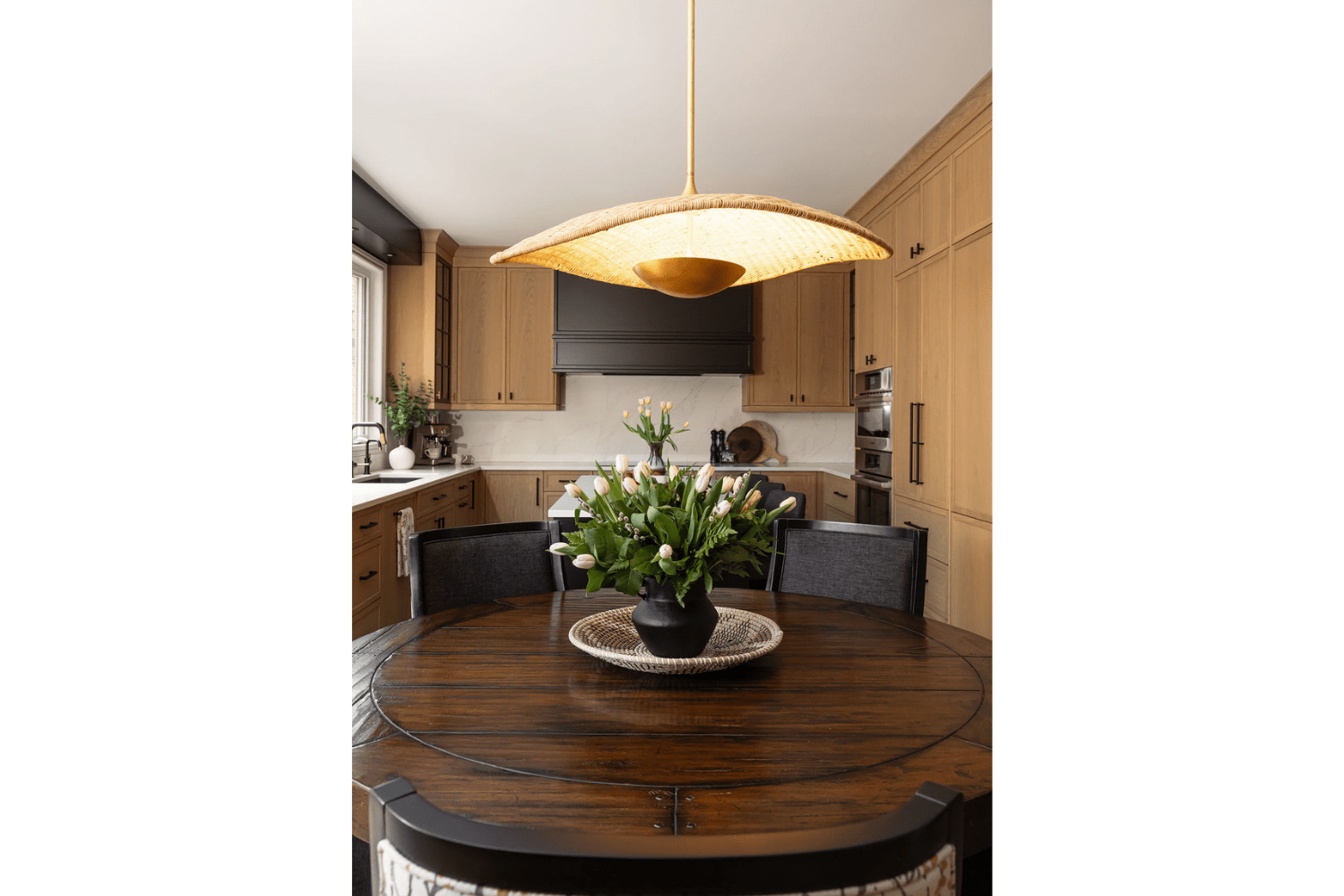 Modern white oak kitchen with traditional charm and black acccen