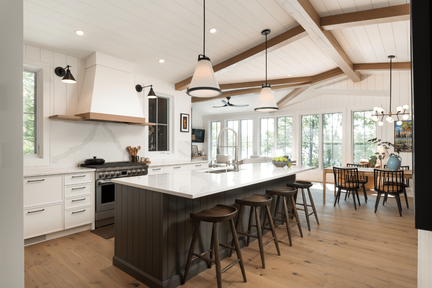 white cottage kitchen with oak shelves and black kitchen island 