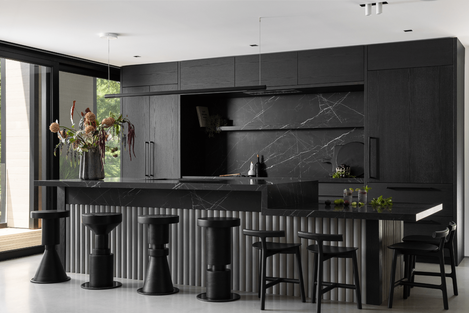 Black kitchen design in luxury guest cottage