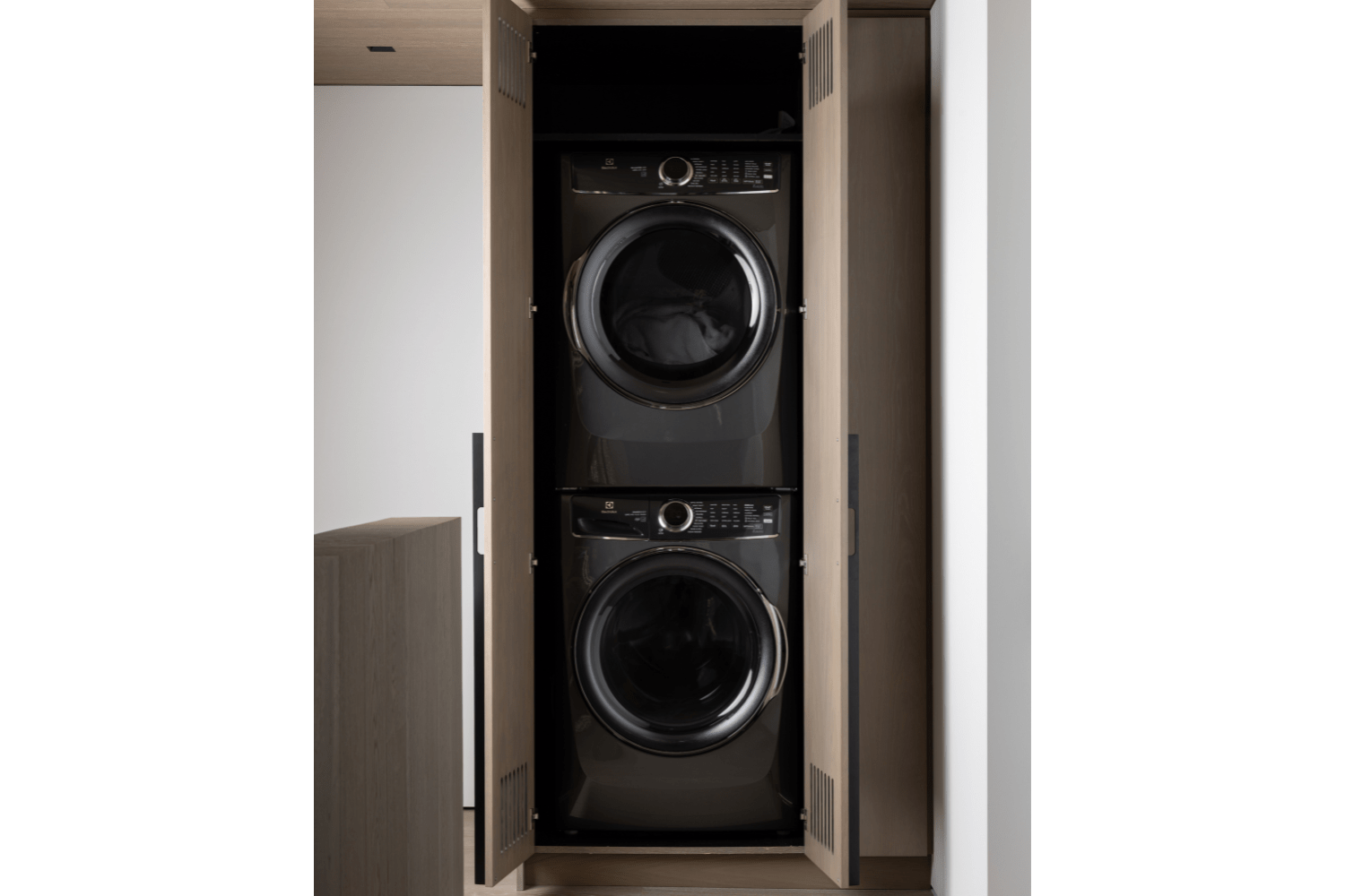 Custom white oak upper laundry closet