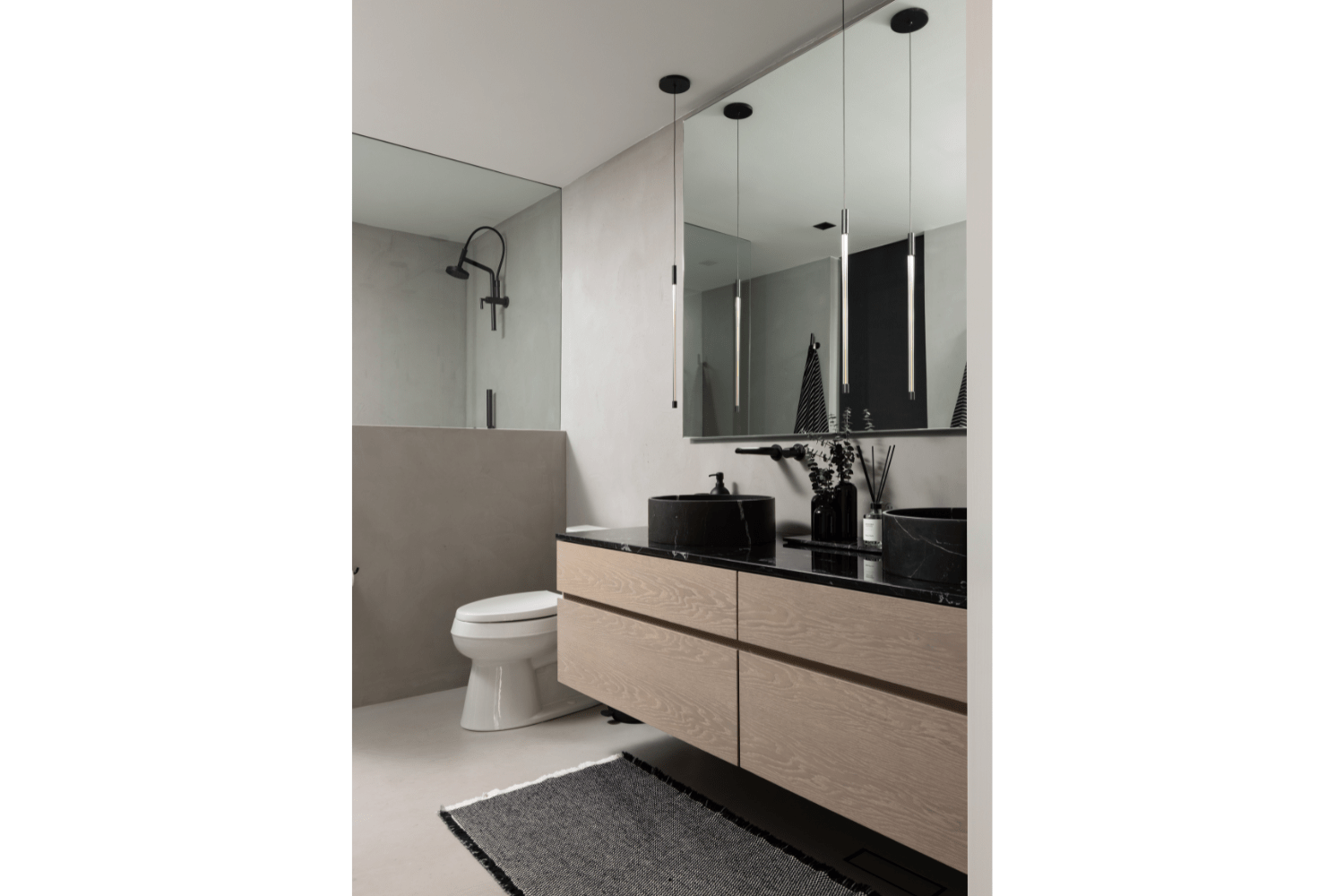 Contemporary white oak bathroom vanity with stone vessel sinks