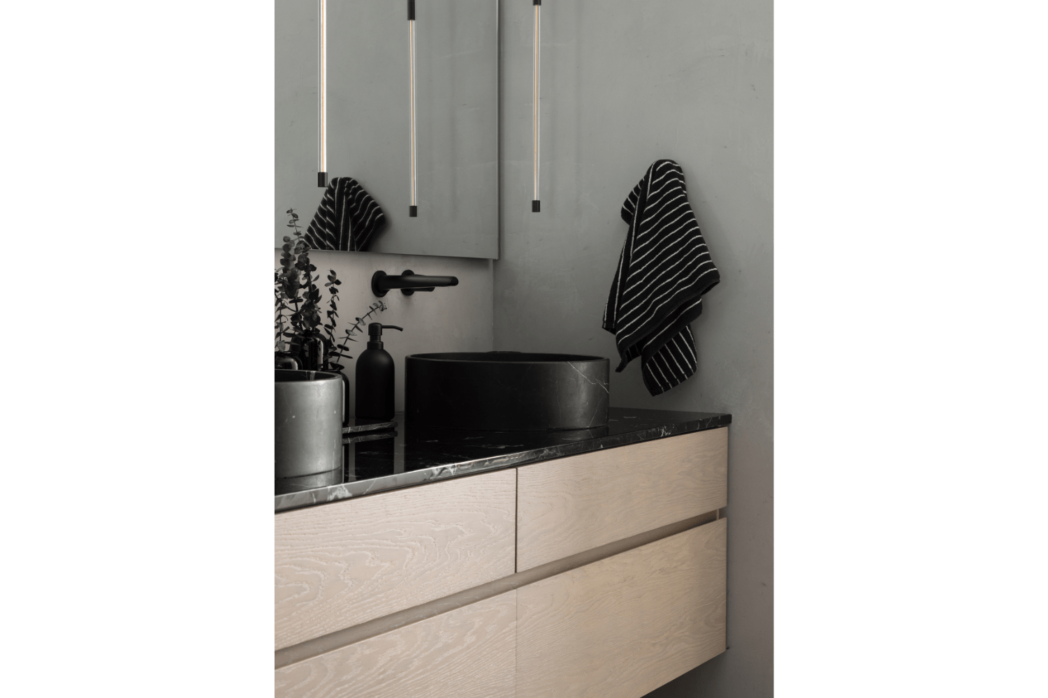 Modern bathroom vanity with vessel sink and wall-mounted faucet