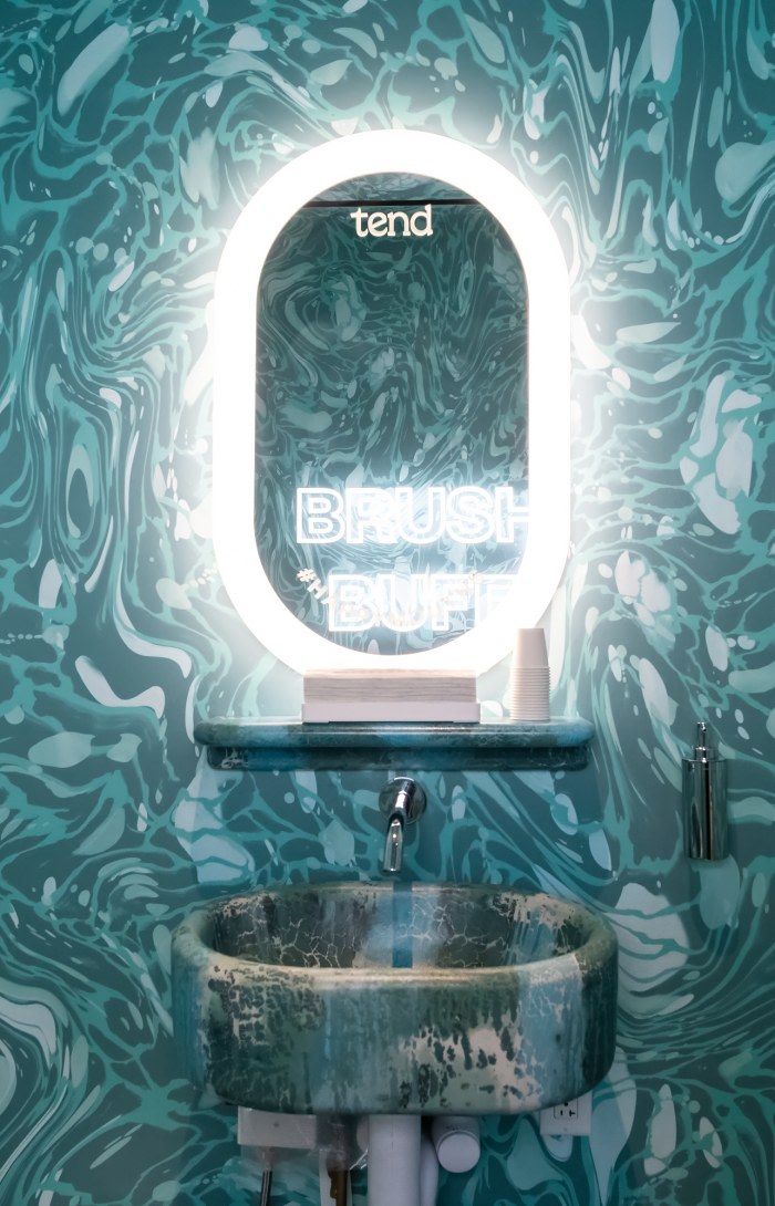 Sink and mirror in teeth brushing area.