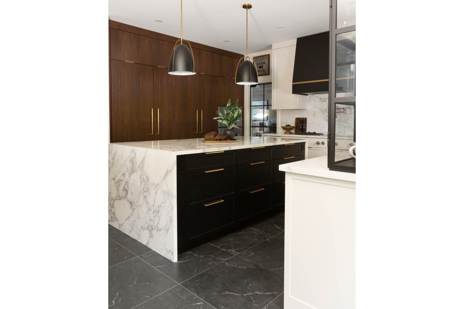 Black kitchen island design with white waterfall countertop