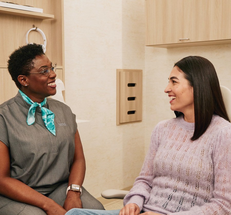 A team member speaks with a patient.