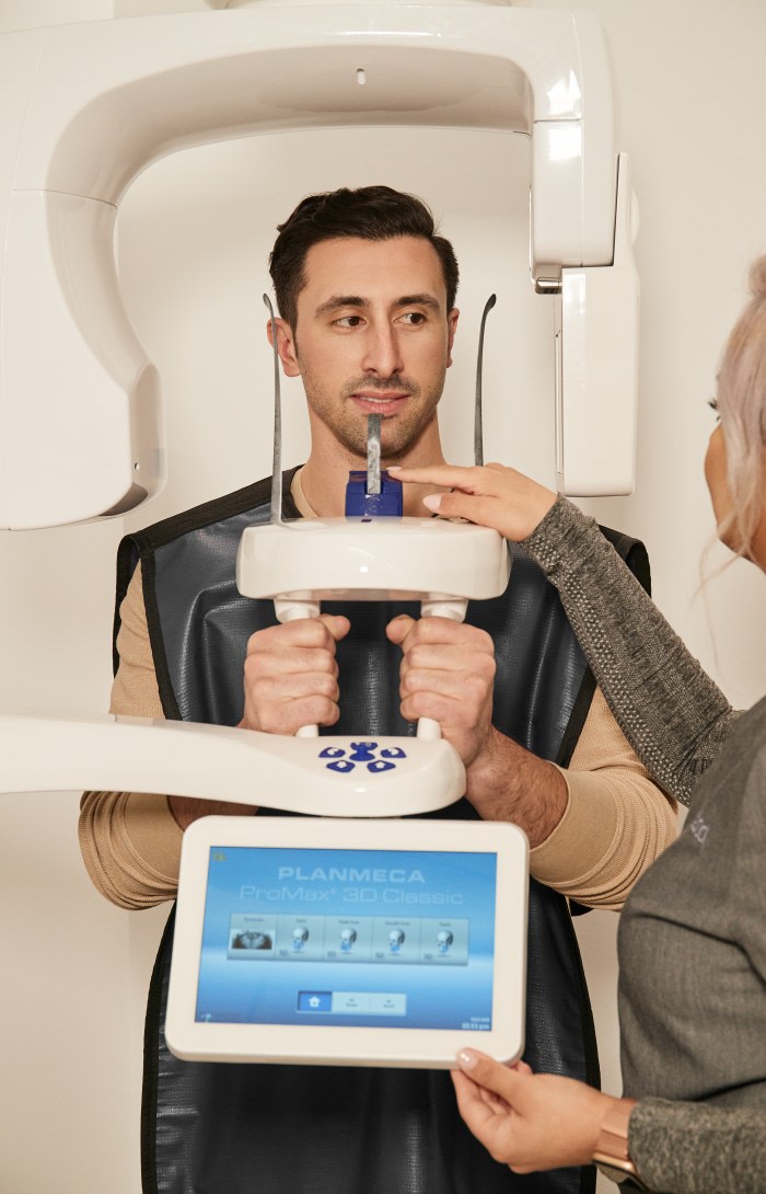 A patient gets a dental X-ray.