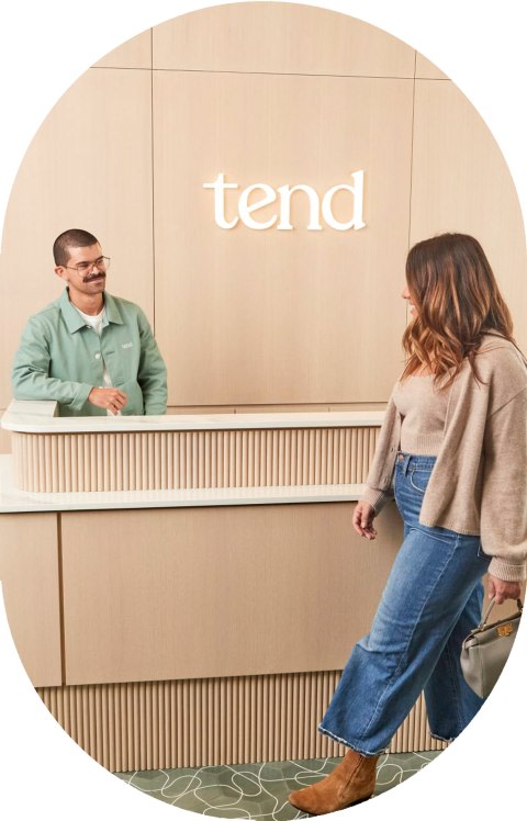 A patient approaches the reception desk.