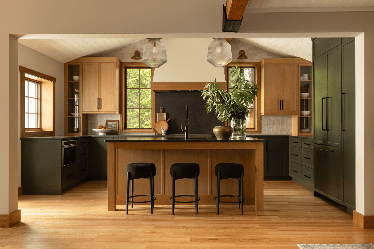 Earthy and organic kitchen design with green and red oak cabinet