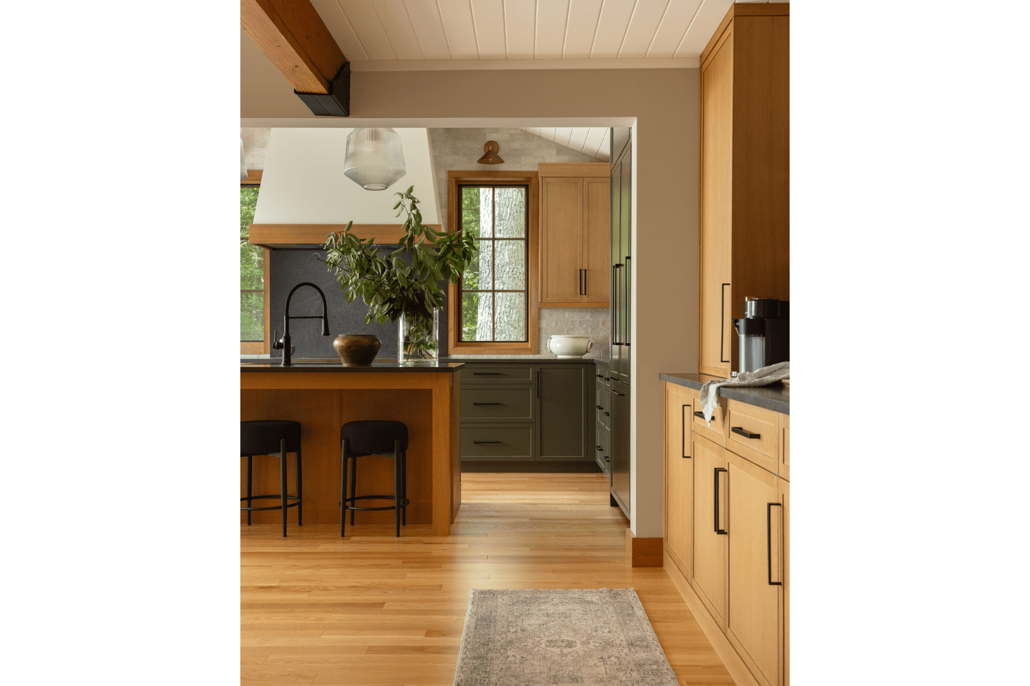 Kitchen and great room design with dining room cabinetry