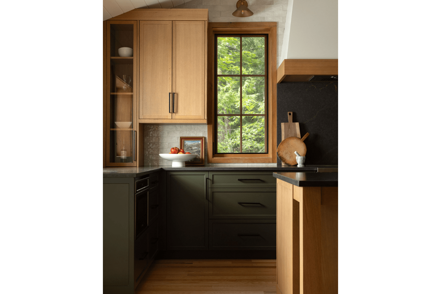 Kitchen design with green lower cabinets and red oak upper cabin