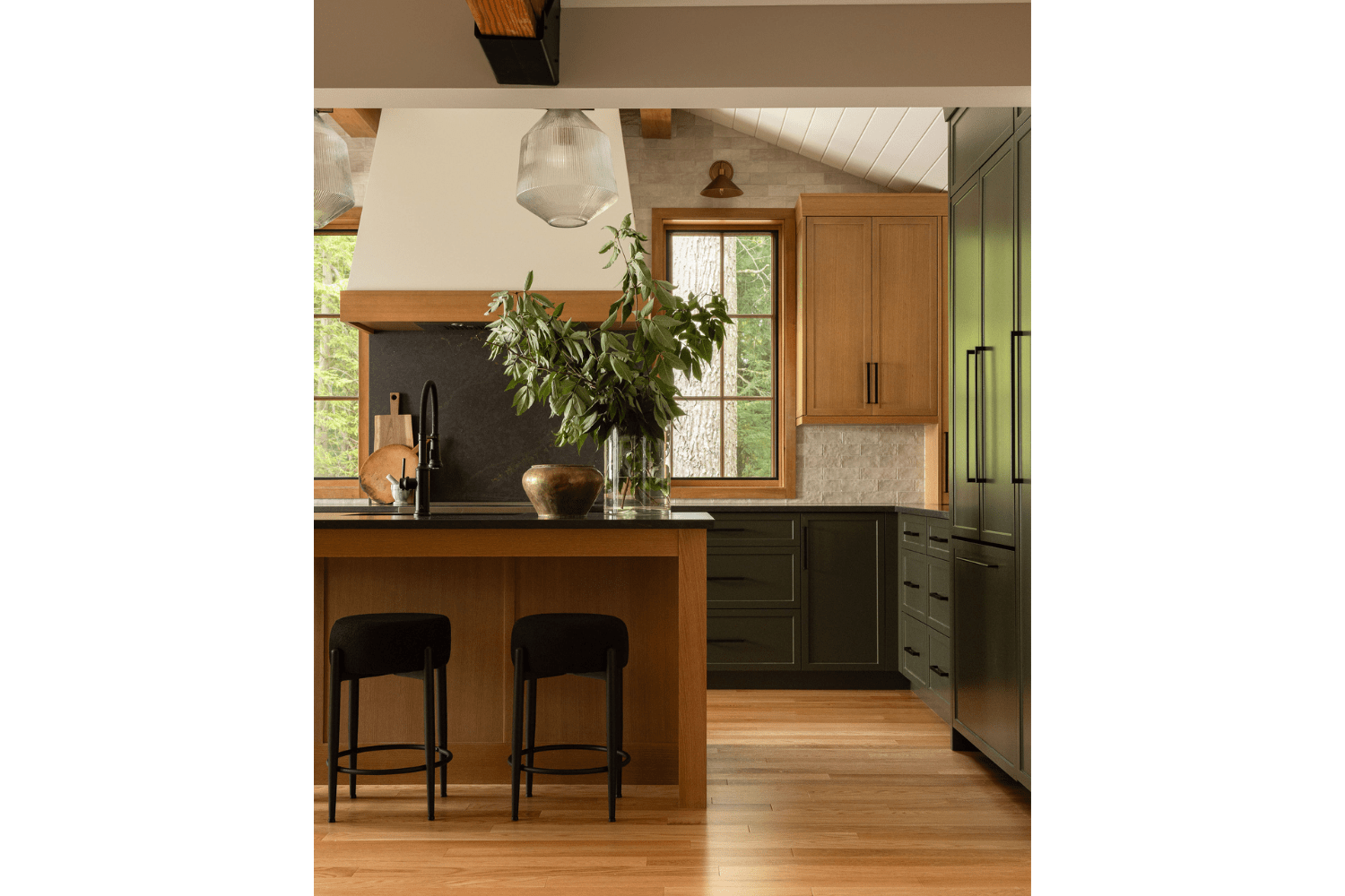 Warm cozy earthy kitchen design with green and red oak cabinetry
