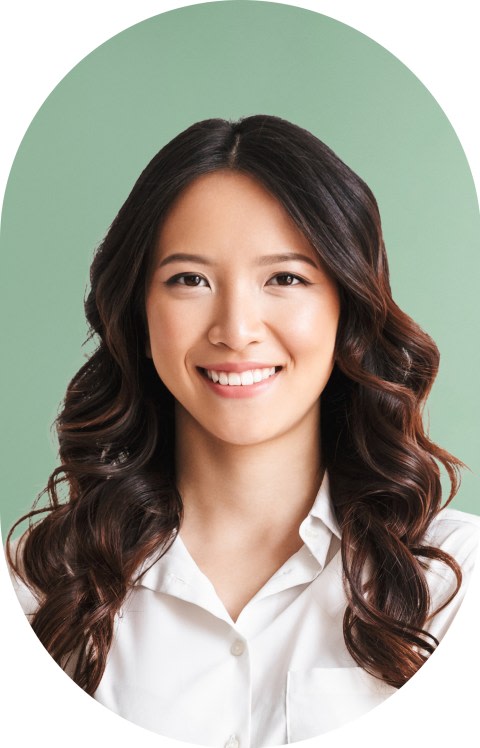 A woman with softly waved hair is smiling.