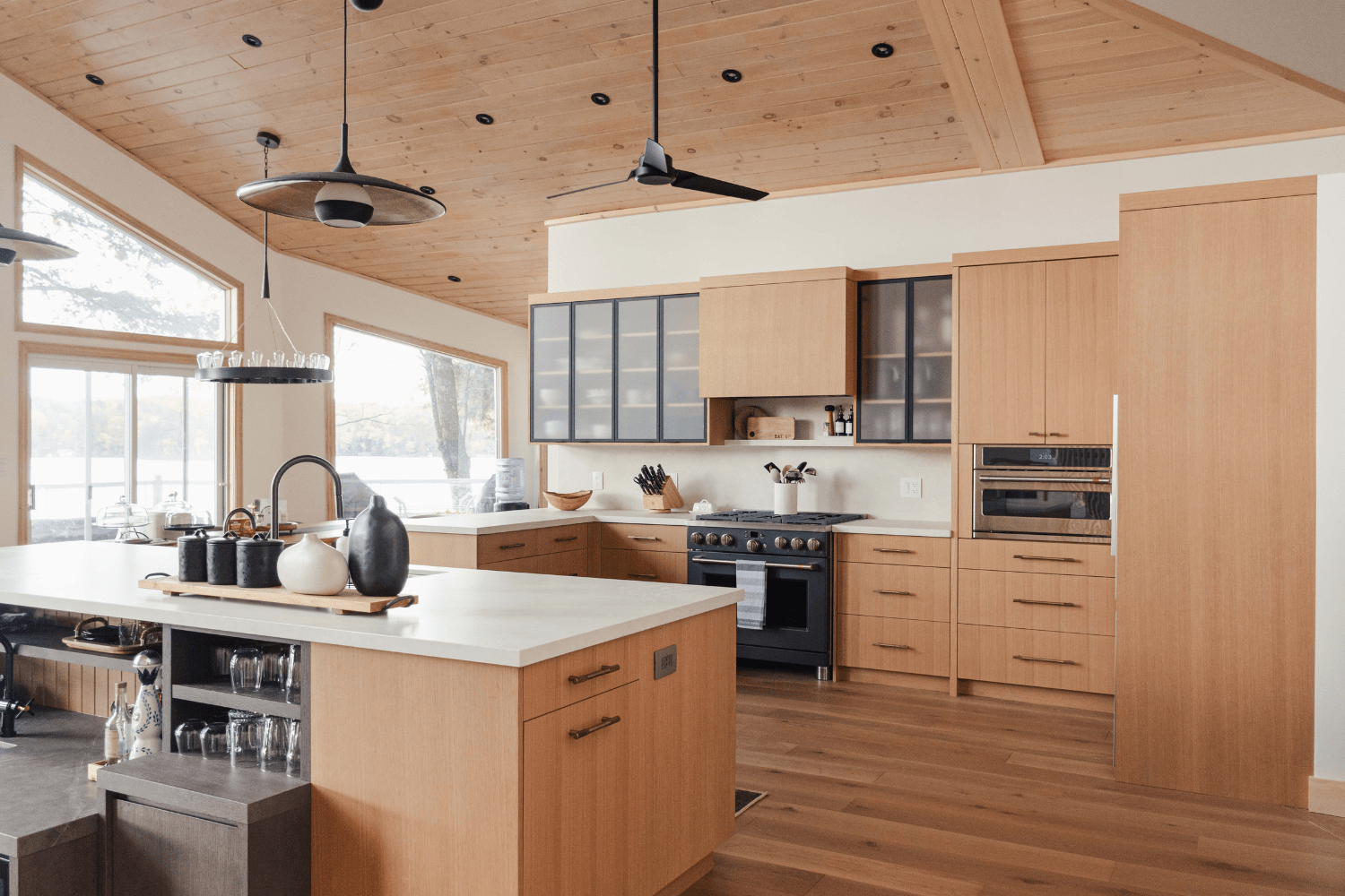 Kitchen island that connects prep space and family room wet bar
