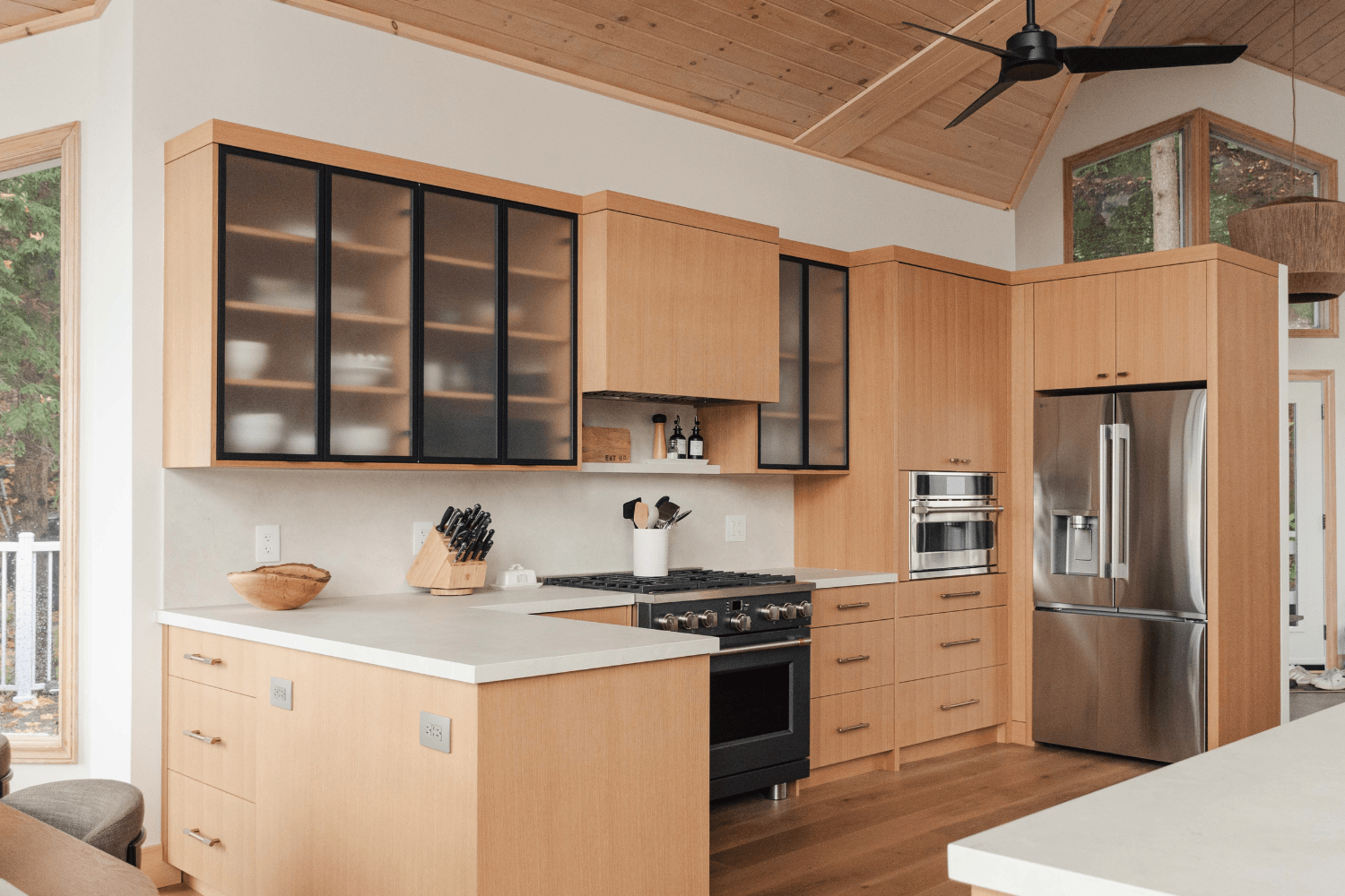 Red oak cottage kitchen with peninsula and island