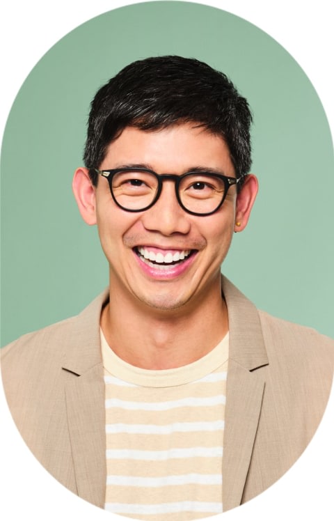 Smiling man with dark rimmed glasses