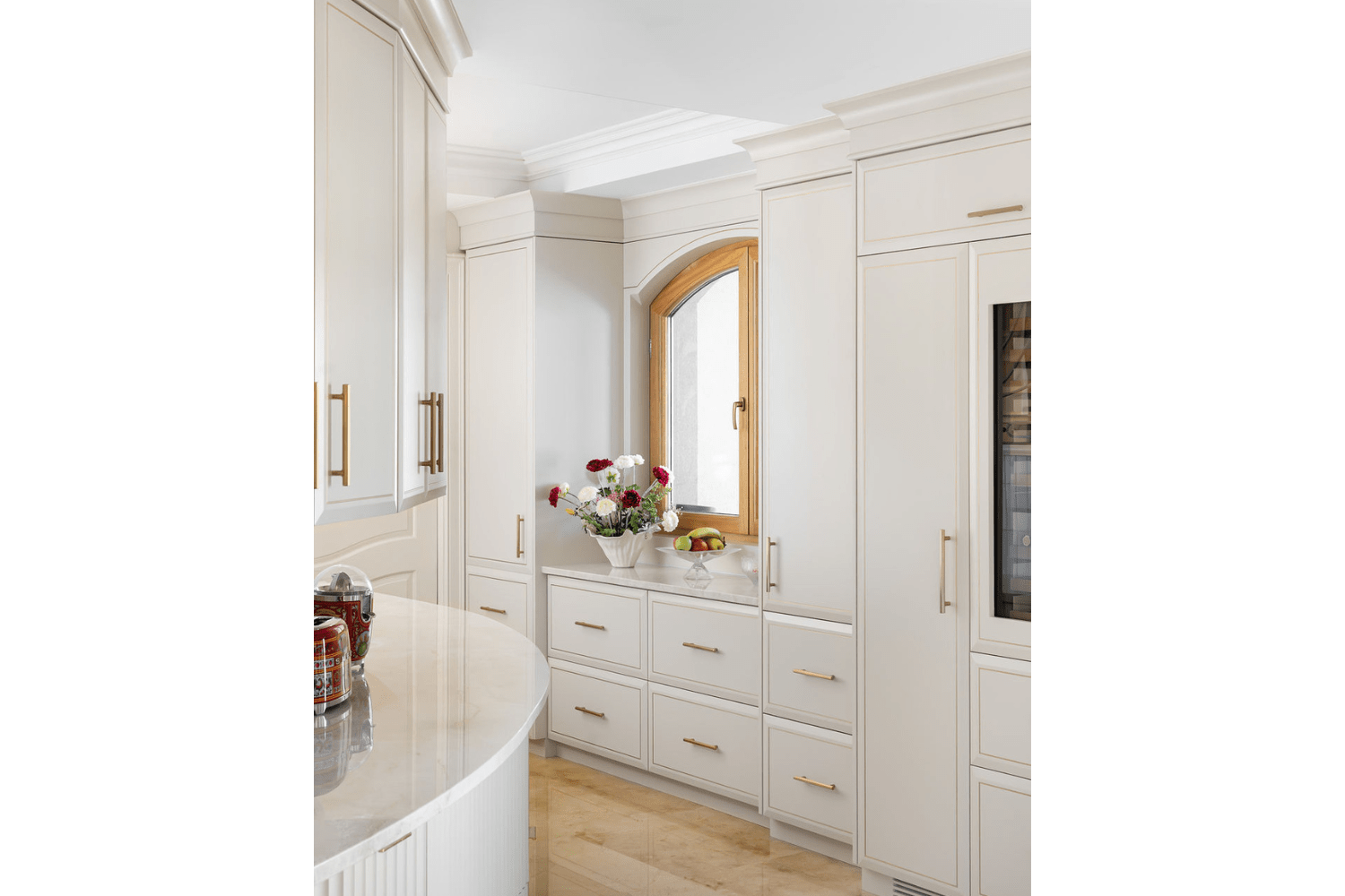 Custom cream cabinetry with crown moulding