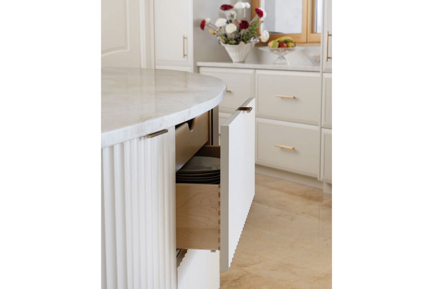 Dovetail fluted drawer in cream finish with brass edge pull