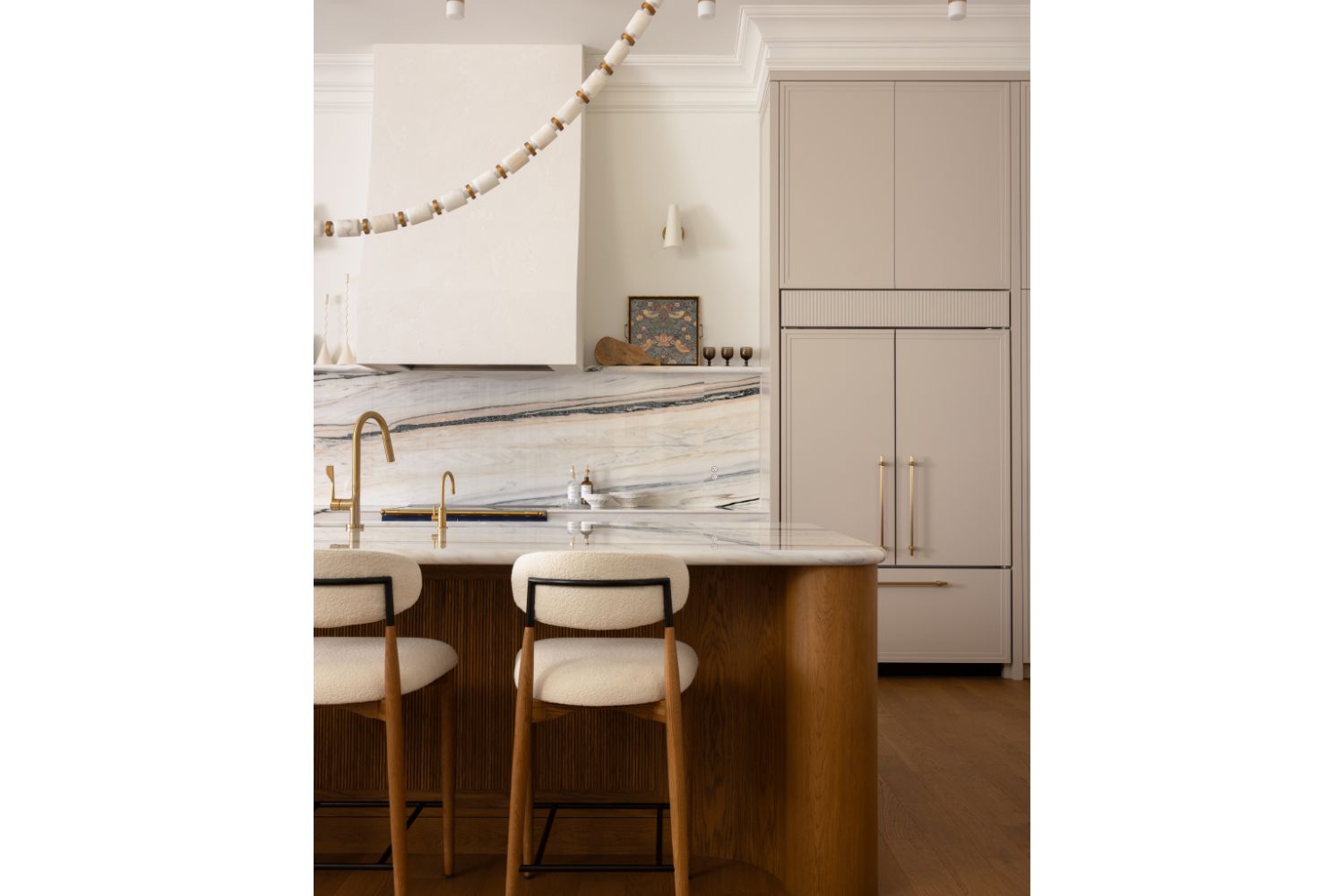 Contemporary kitchen design with warm tones and marble