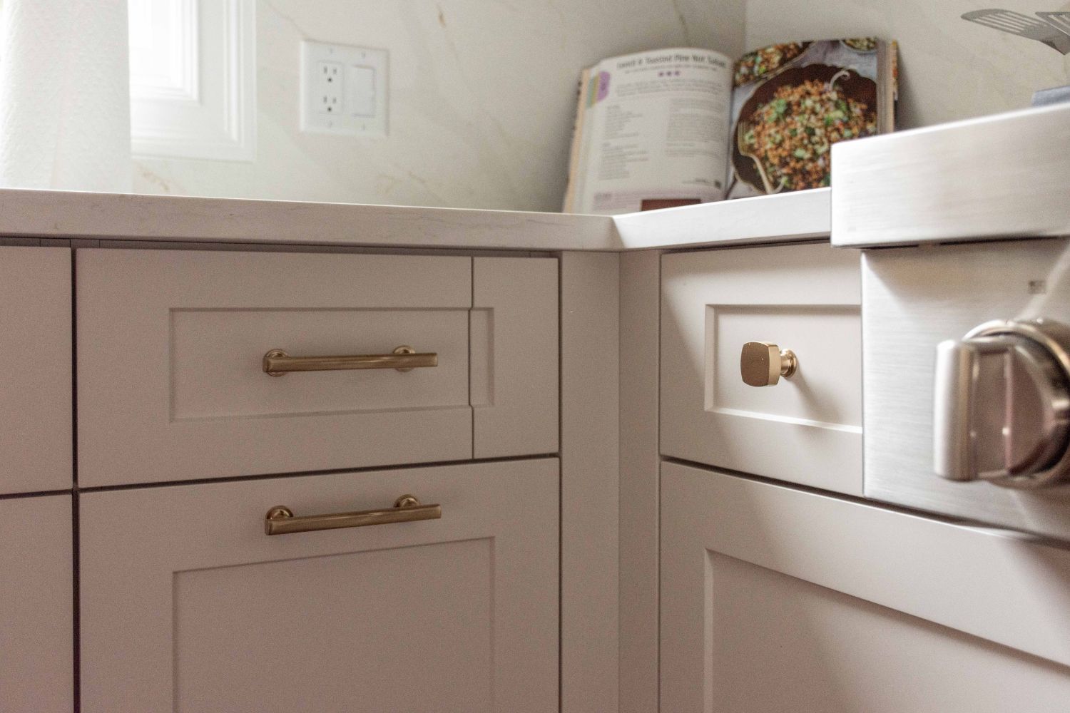 Custom kitchen solution for drawer clearance by cooktop knobs