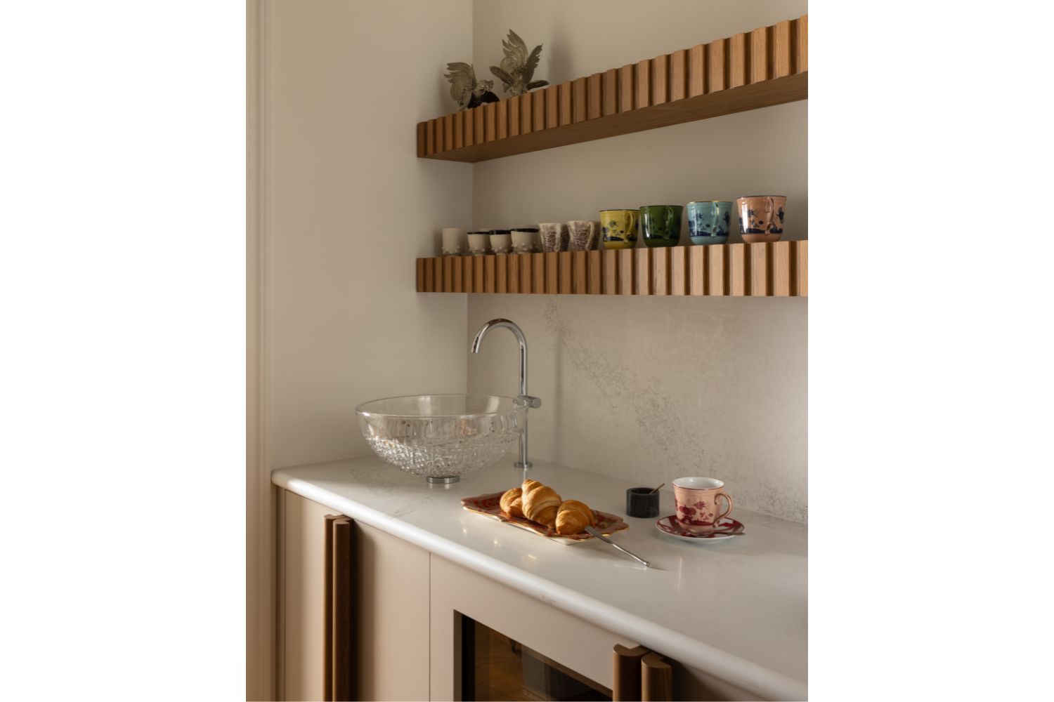 Floating white oak shelves with slatted edge in butler pantry