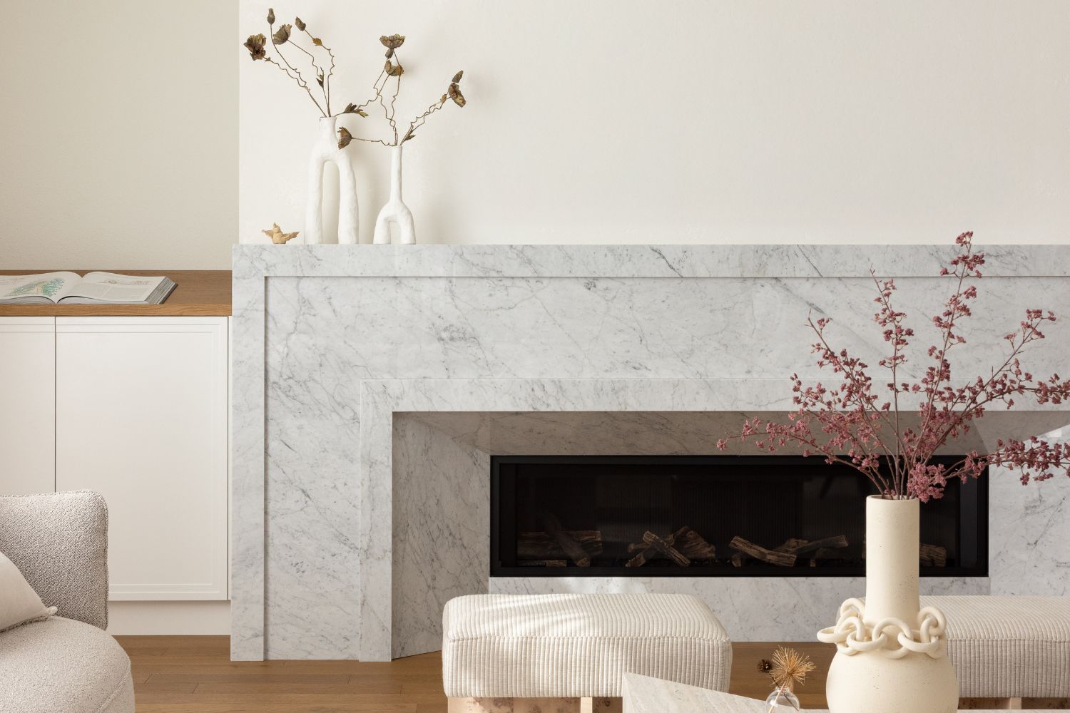 Stone fireplace wall with cabinets