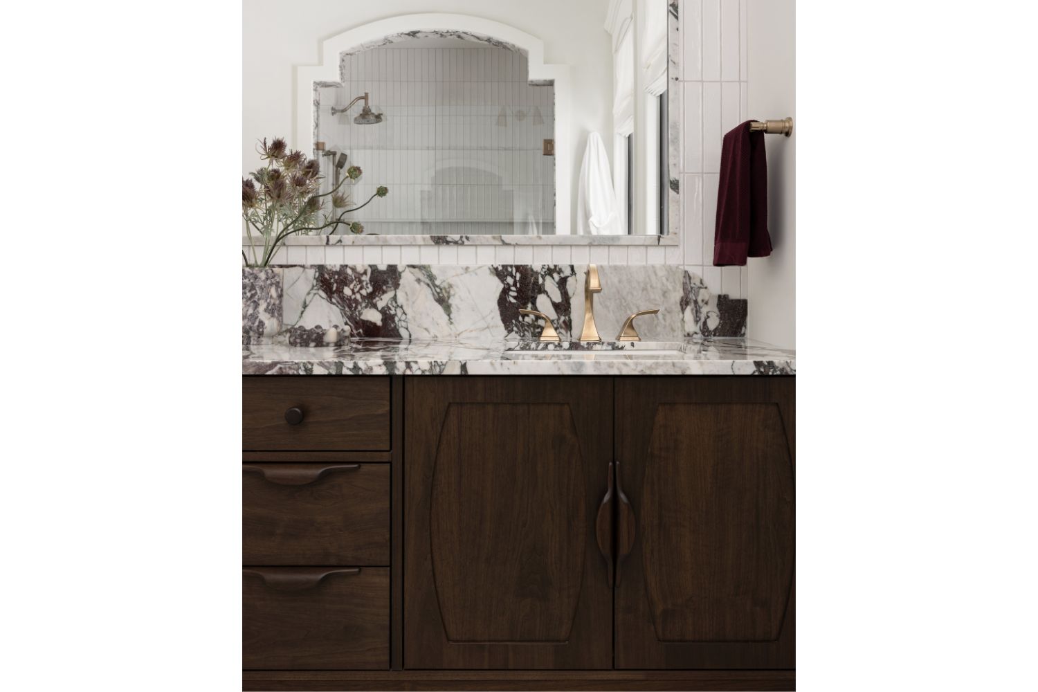 Sculptural bathroom vanity with custom door fronts and pulls