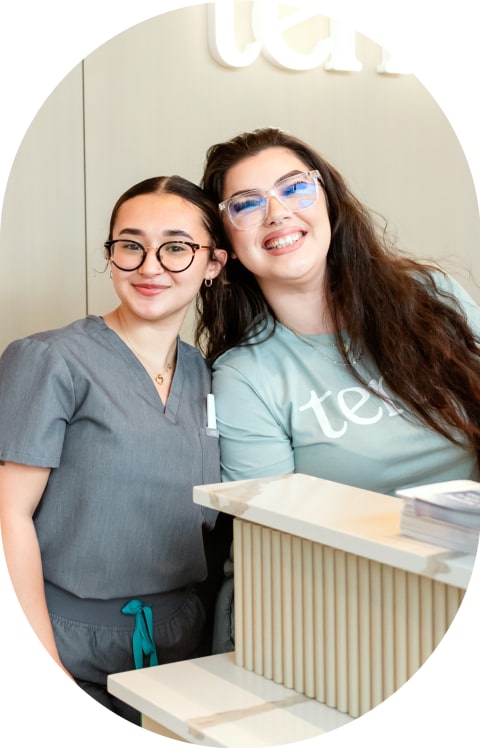 Two Tend Dental employees smile.