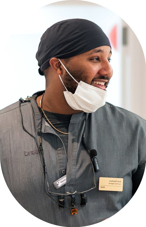 An employee is smiling.
