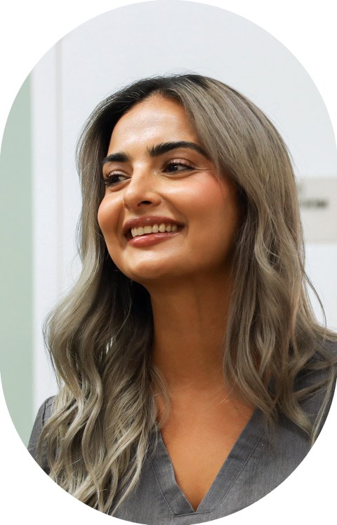 An employee is smiling.