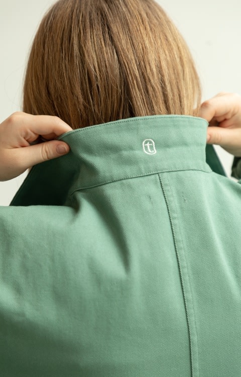 A team member is wearing a jacket with a Tend logo.