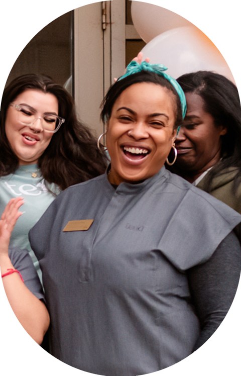 An employee is smiling.