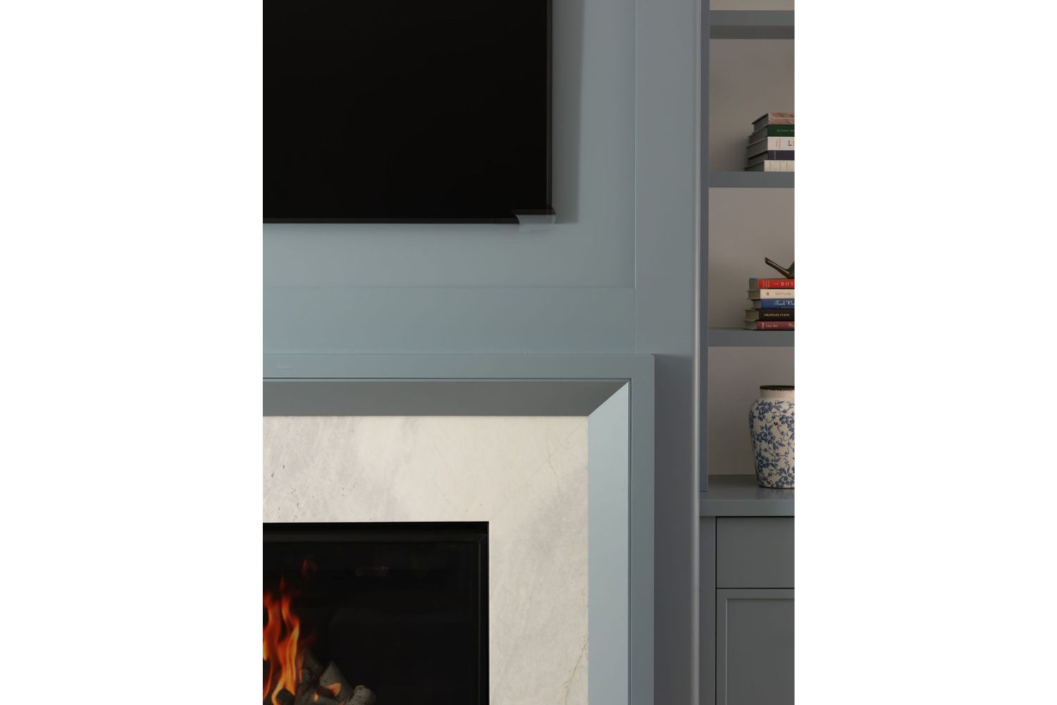 Custom blue fireplace feature wall with stone fireplace