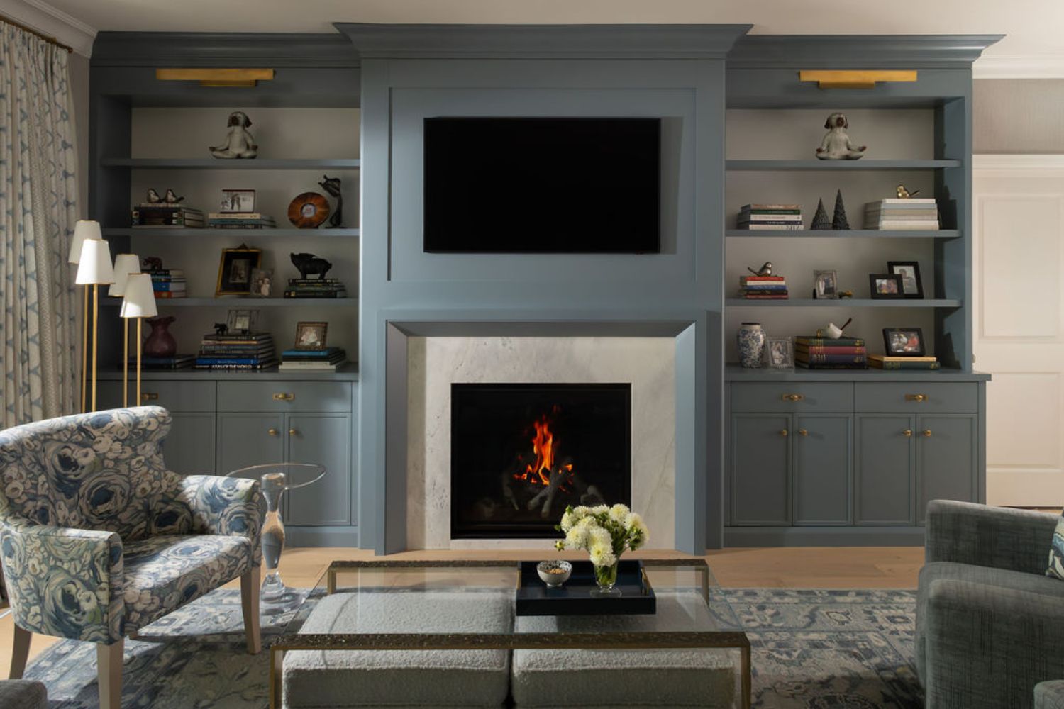 Custom family room TV wall unit with stone fireplace
