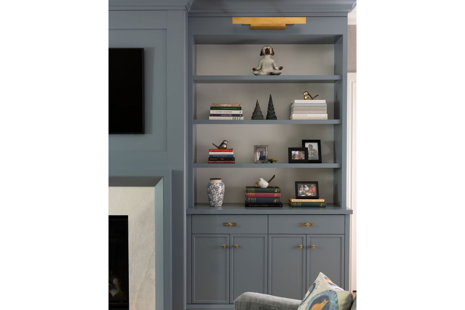 Family room TV wall with open shelving bookcase in blue finish