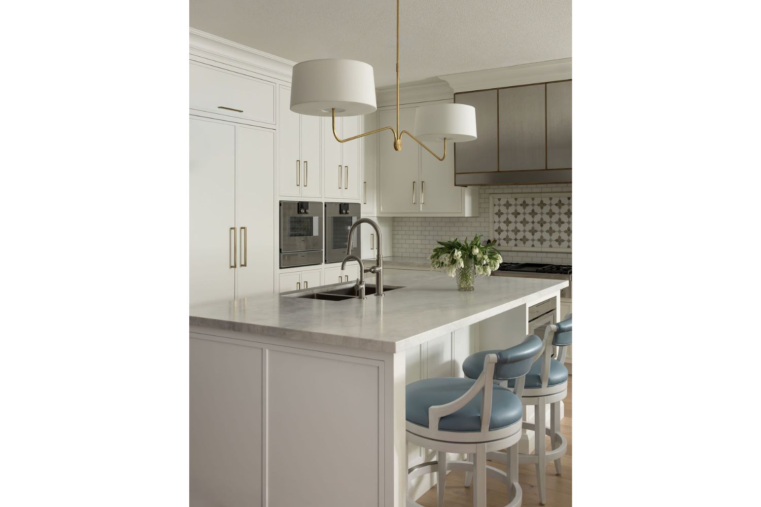White kitchen island in transitional kitchen design