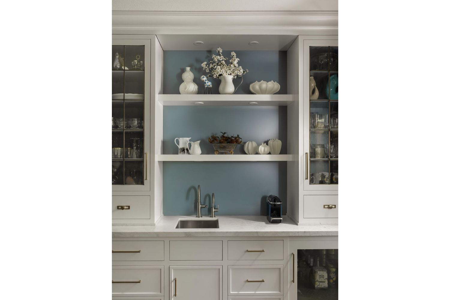 Dining room servery with small sink and blue accent wall