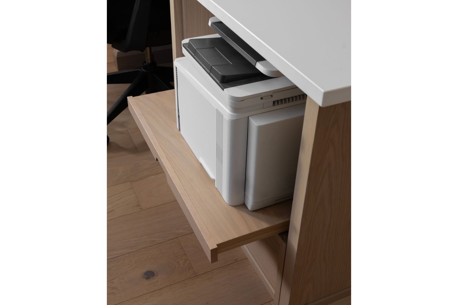 Custom pull-out shelf for printer in custom white oak home offic