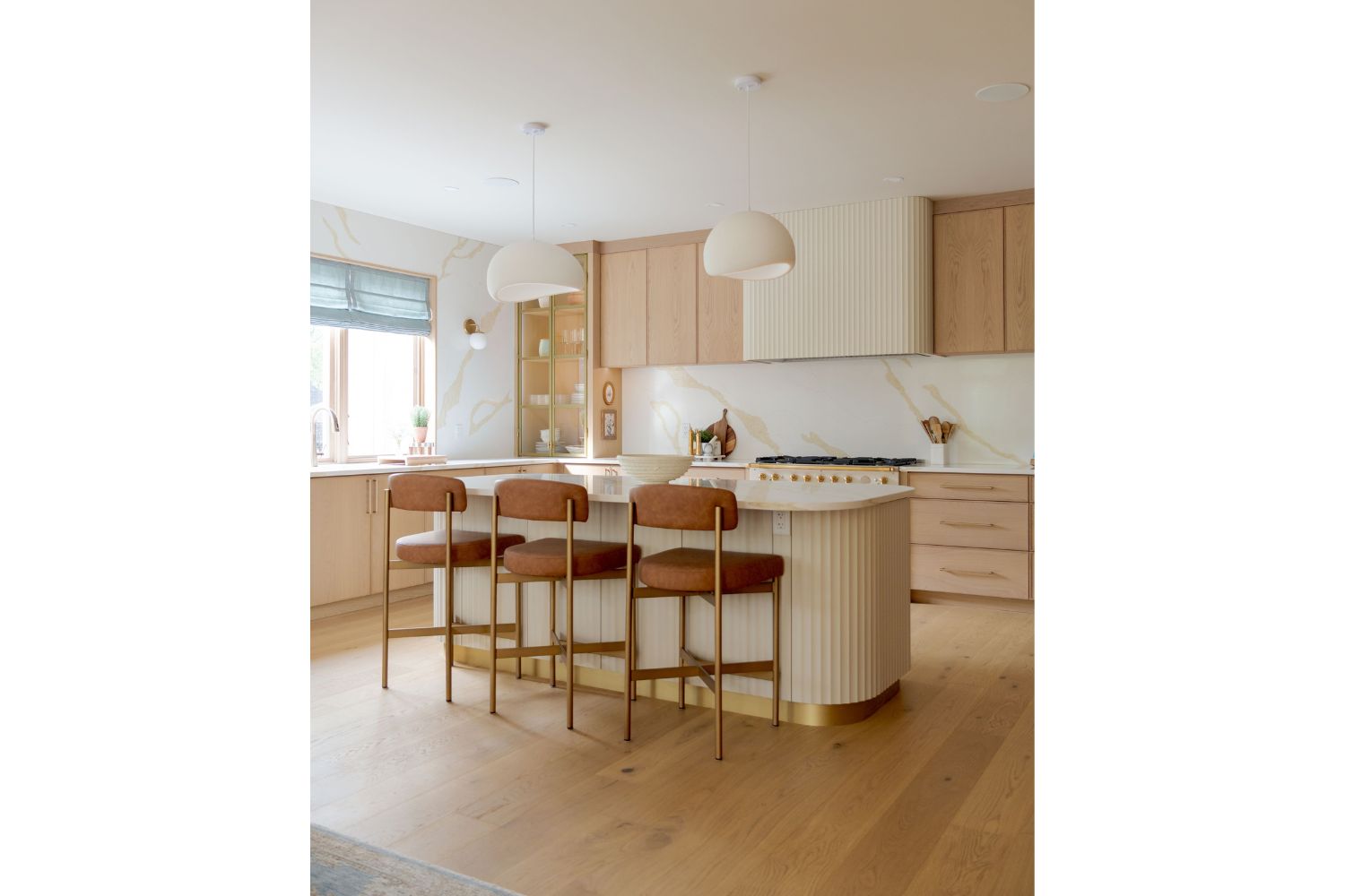 White oak and cream kitchen design with gold accents