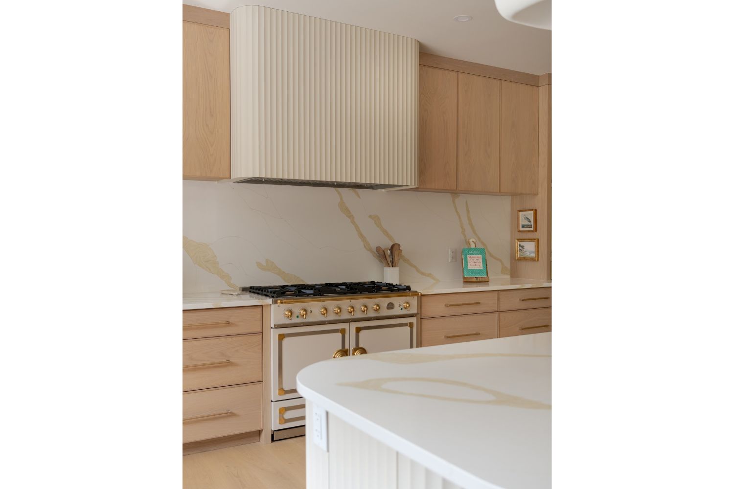 Custom white fluted range hood design in contemporary kitchen