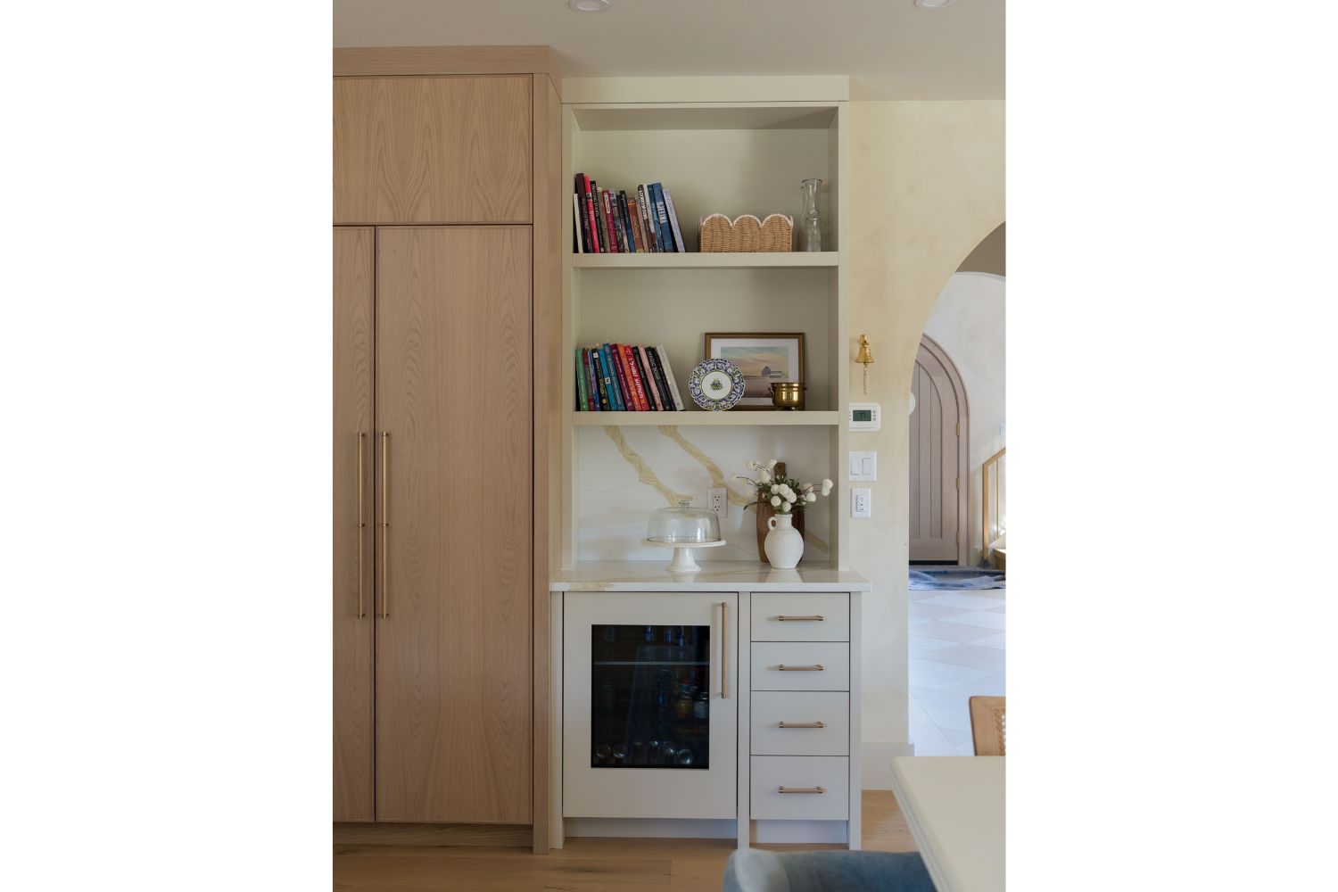 Kitchen beverage bar with panel ready beverage fridge and open s