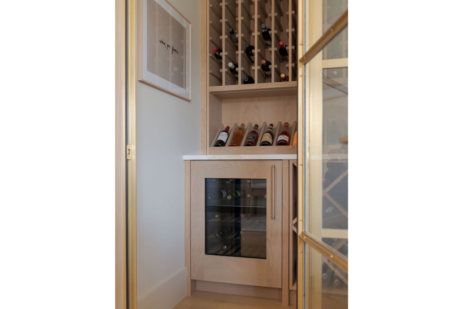 Luxury wine room with panel ready white oak wine fridge